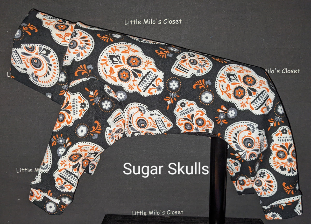 Sugar Skulls Halloween bodysuit for Italian Greyhounds, black with orange and white skulls, on a dog form