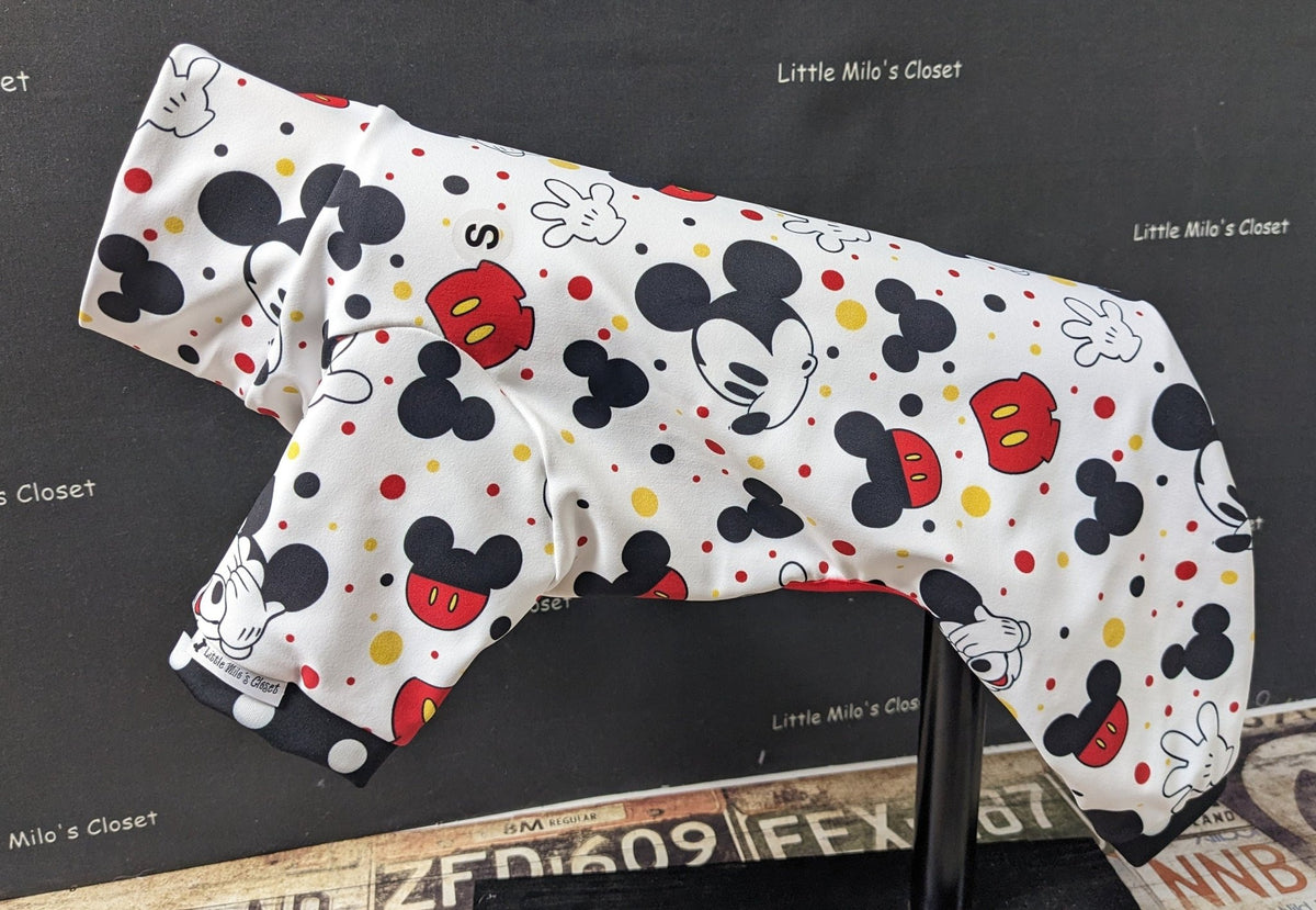 Boy Mouse UPF 50 capri bodysuit, white with cartoon mouse faces and red dots, on a dog form