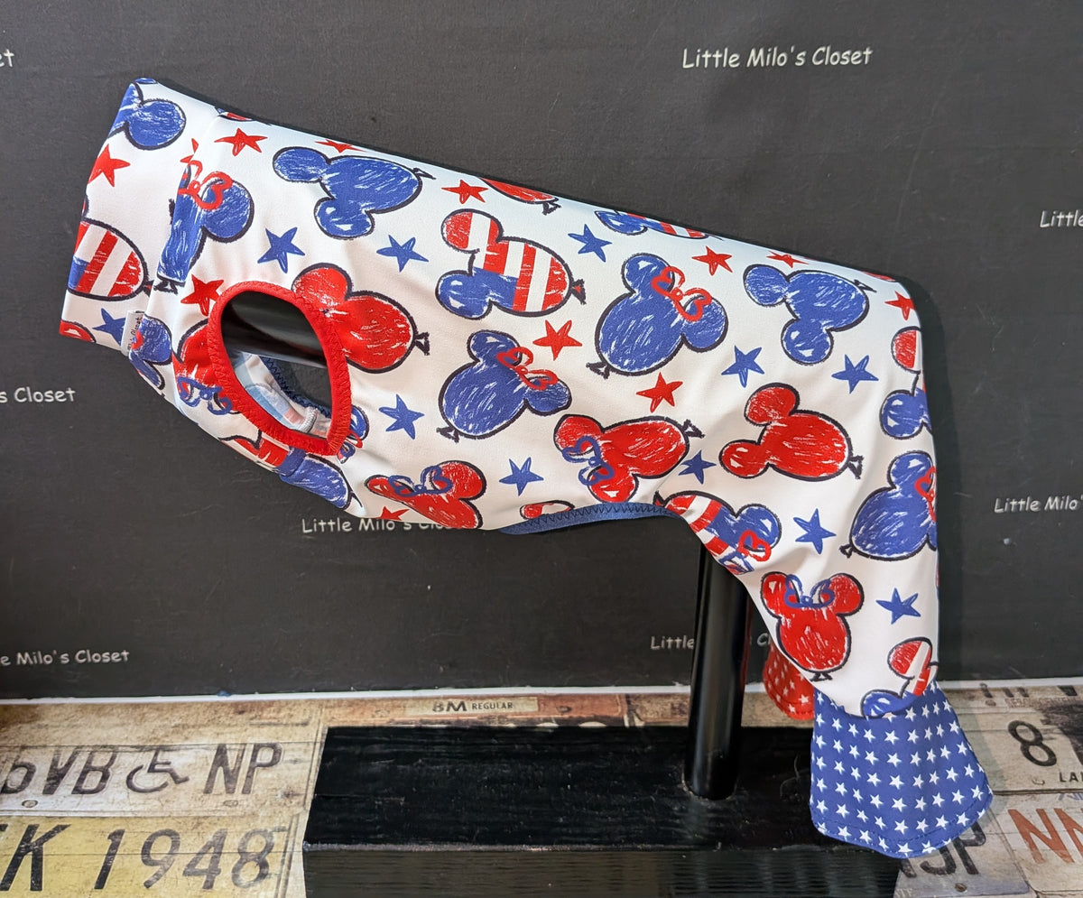UV mouse bell bottoms with red, white and blue mouse head print and blue star bell cuffs, side view on a dog form