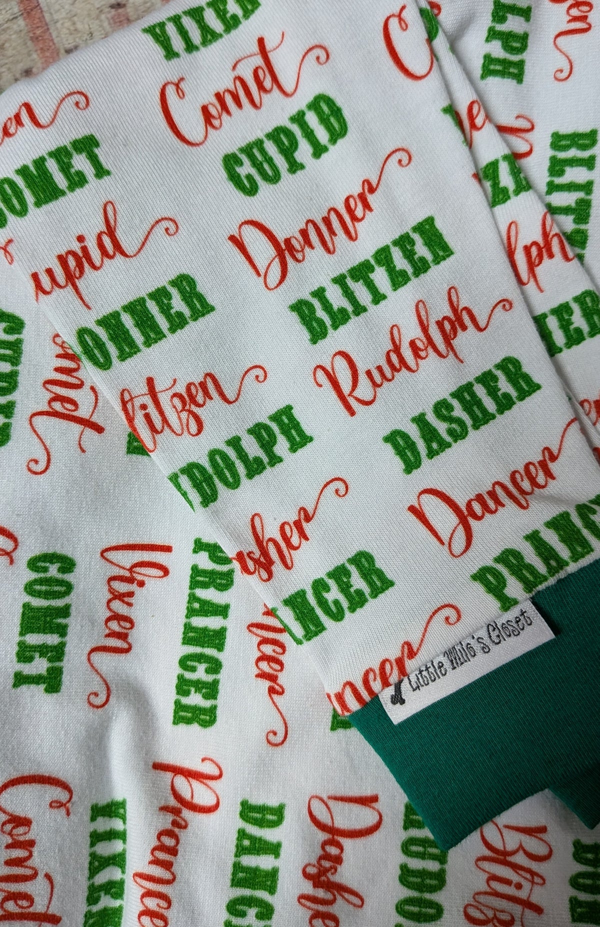 Reindeer Names Christmas two legged top for Italian Greyhounds, white with red and green script names, folded