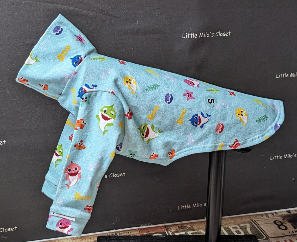 Baby Shark long sleeve Italian Greyhound top, light blue with cartoon sharks and starfish, on a dog form