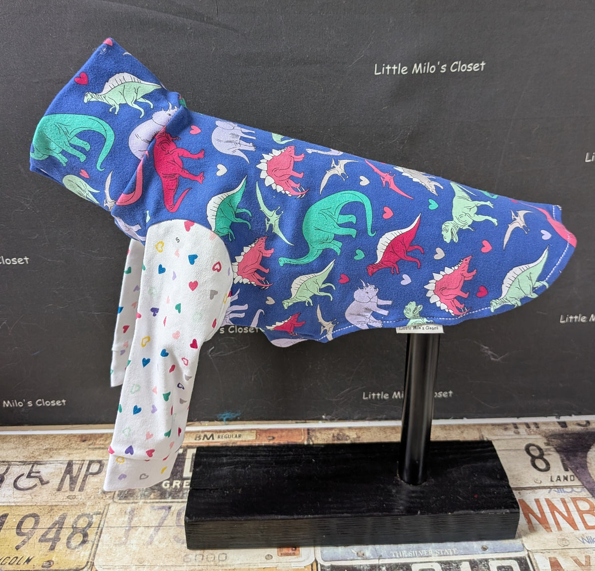 Royal blue Dino Love cotton lycra long sleeve top with pastel dinosaurs and a heart print sleeve, on a dog form