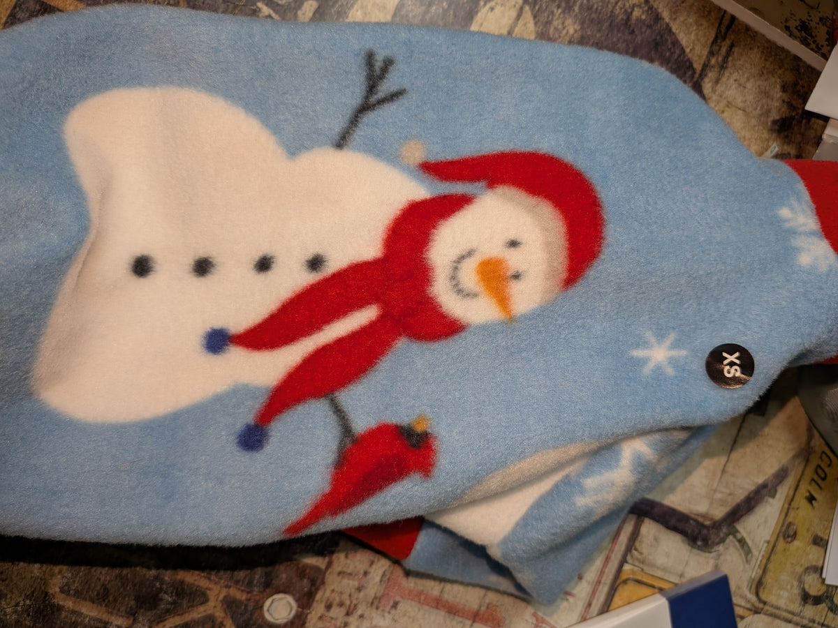 Close-up of Snowman on Blue fleece jammies, a snowman with a red scarf and a cardinal on light blue