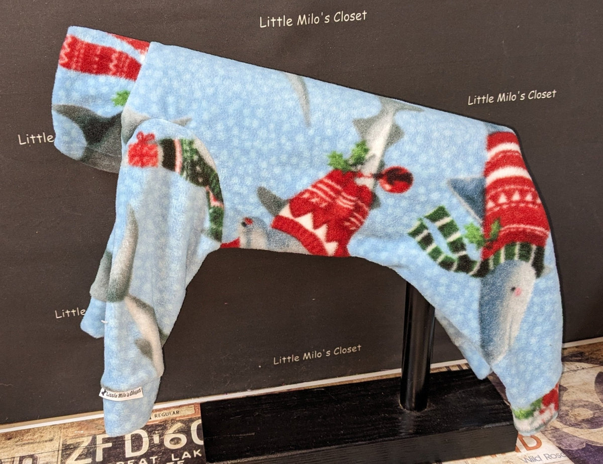 Santa Sharks plush fleece jammies for Italian Greyhounds, light blue with sharks in Santa hats and sweaters, on a stand
