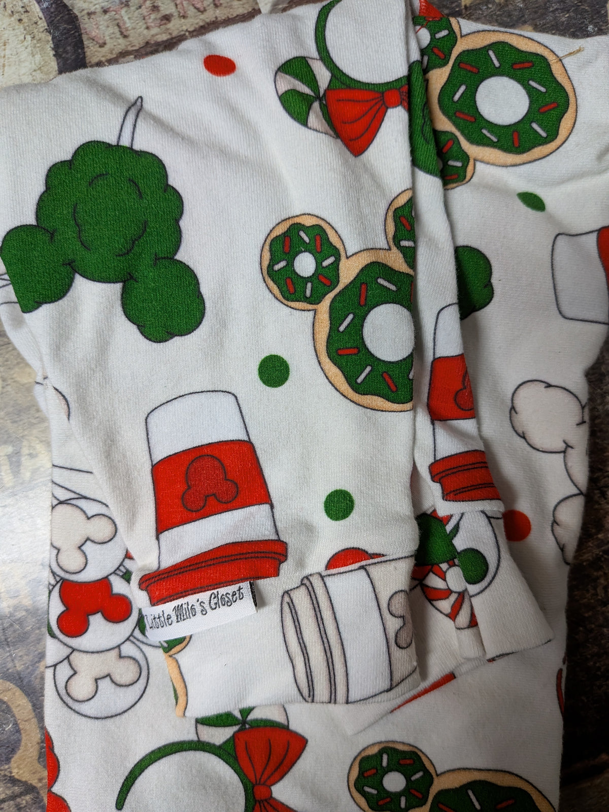 Christmas Mouse Latte two legged top, white with mouse ear donuts, popcorn and red cups, folded flat