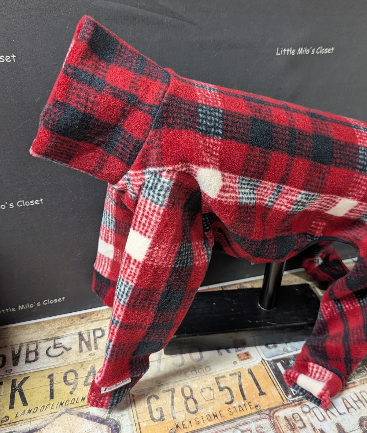 Red and black buffalo plaid fleece bodysuit, side view on an Italian Greyhound dog form