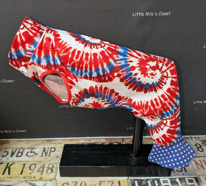 Red, white and blue tie dye swirl bell bottoms for an Italian Greyhound with blue star print bell cuffs, on a dog form