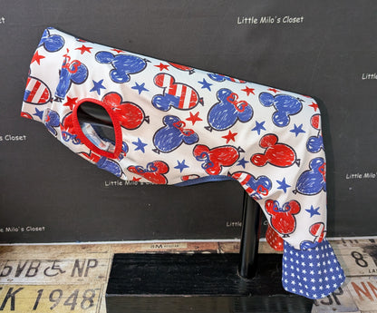 UV mouse bell bottoms with red, white and blue mouse head print and blue star bell cuffs, side view on a dog form