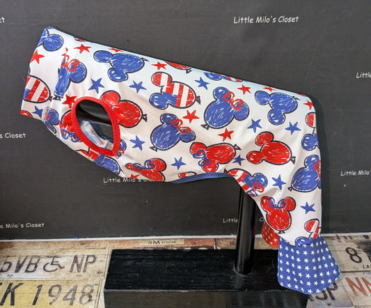 UV mouse bell bottoms with red, white and blue mouse head print and blue star bell cuffs, side view on a dog form