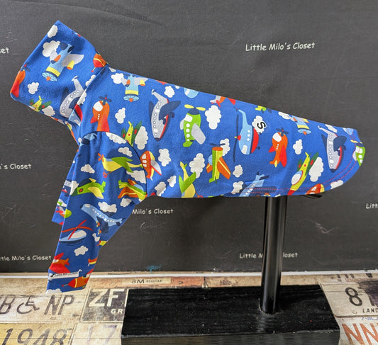 Royal blue cotton lycra long sleeve top with cartoon airplanes and clouds, side view on an Italian Greyhound dog form