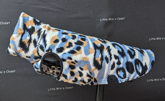 Blue and orange animal print fleece vest for Italian Greyhounds on a dog form, showing the leg opening