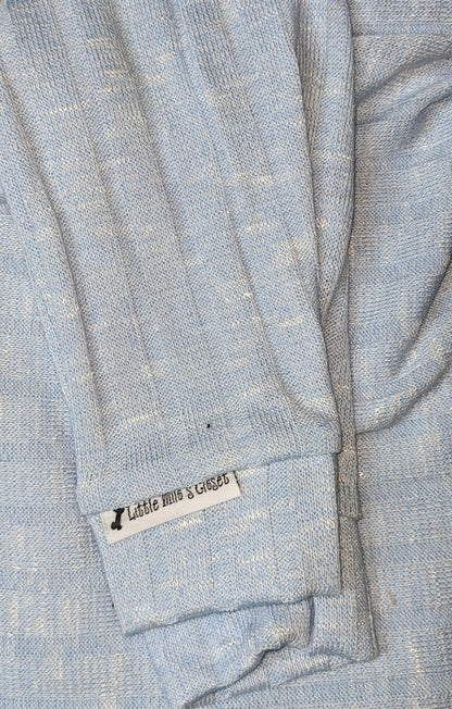 Light blue rib knit Italian Greyhound sweater, folded close-up of the sleeve