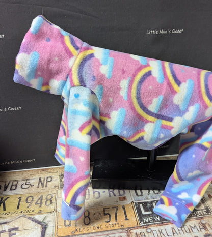 Pastel pink and lavender fleece bodysuit with rainbows and clouds, side view on an Italian Greyhound dog form