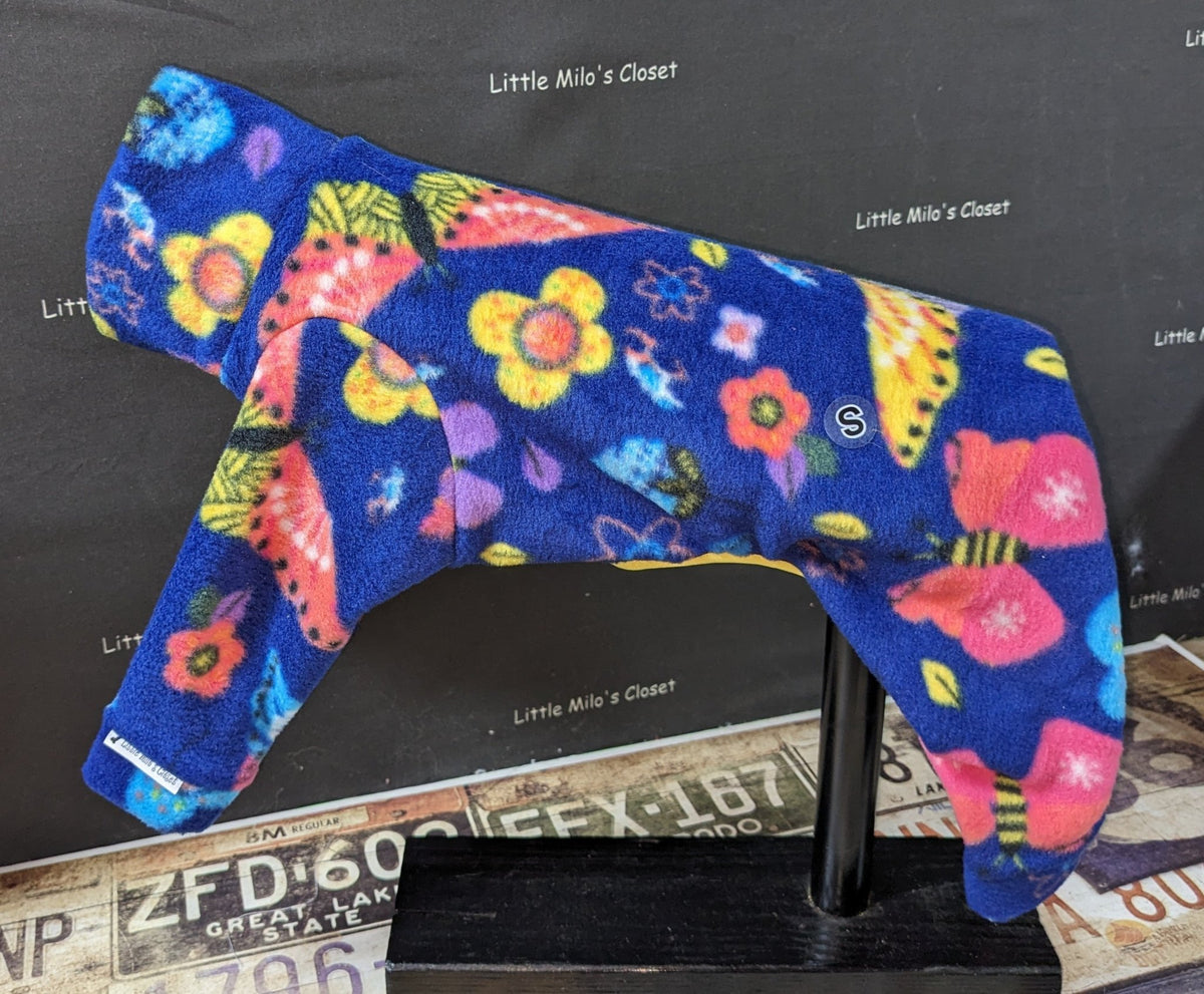 Royal blue fleece bodysuit with bright butterflies and flowers, side view on an Italian Greyhound dog form