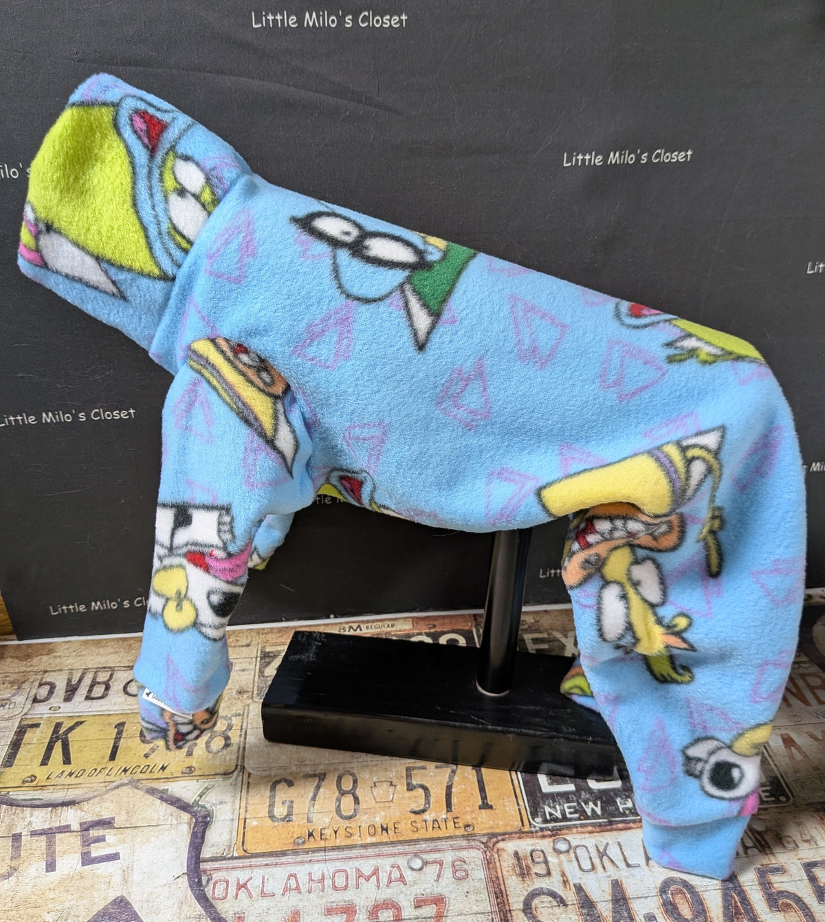 Light blue Ren and Stimpy cartoon fleece bodysuit for a medium Italian Greyhound, side view on a dog form