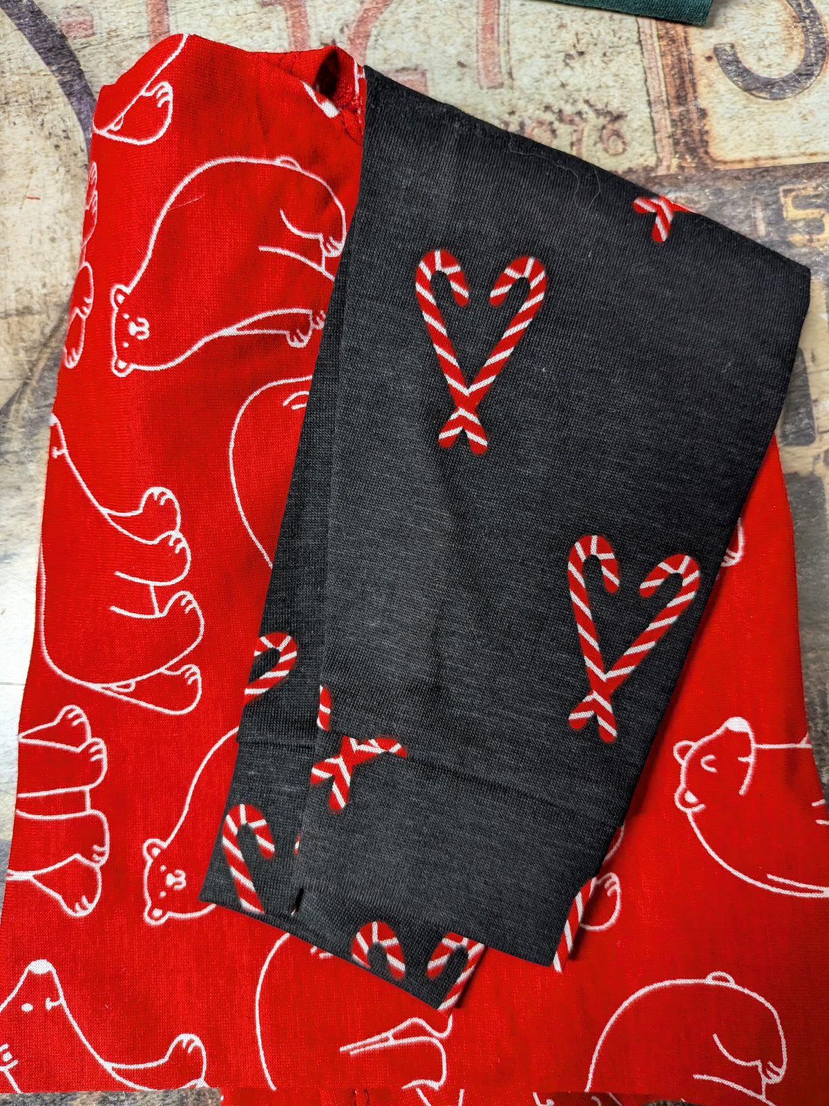 Folded Polar Bears and Candy Canes two legged top, red with white bears and black candy cane sleeves