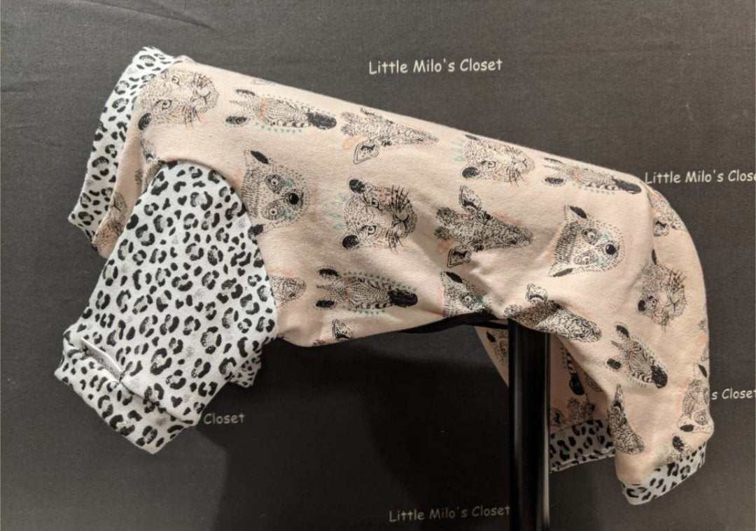 Jungle Animals capri bodysuit, blush pink with sketched animal faces and black and white leopard sleeves