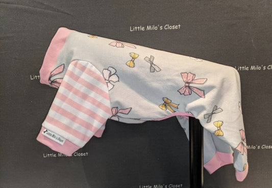 Ribbons and Bows capri bodysuit, white with pastel bows and pink striped sleeves, on a dog form