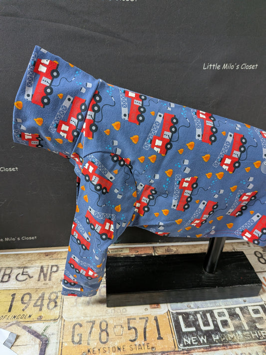 Blue cotton lycra long sleeve top with red fire trucks, side view on an Italian Greyhound dog form