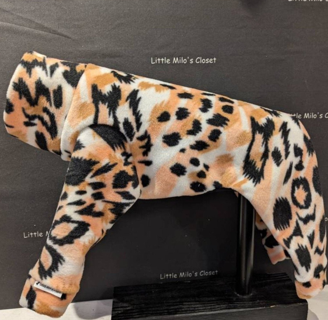 Peach and black leopard print plush fleece Italian Greyhound bodysuit, side view on a display form