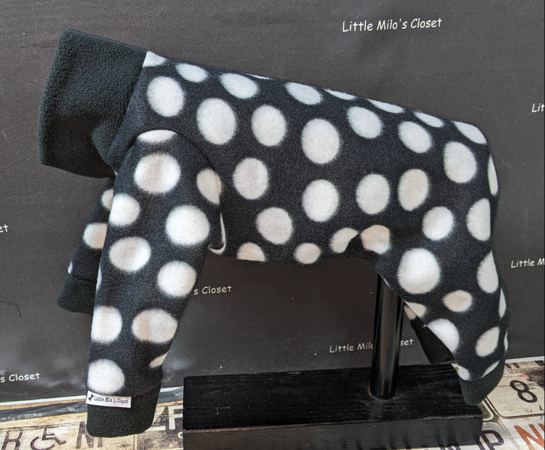 Black plush fleece Italian Greyhound bodysuit with white polka dots and a solid black collar, on a form