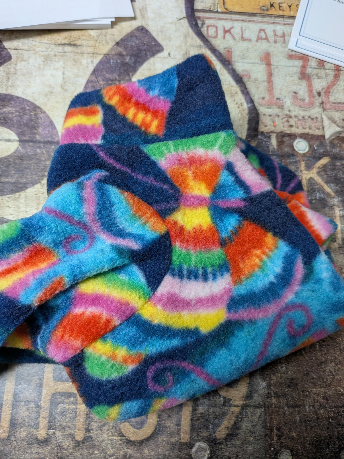 Folded navy plush fleece bodysuit with rainbow tie dye butterflies, extra small Italian Greyhound size