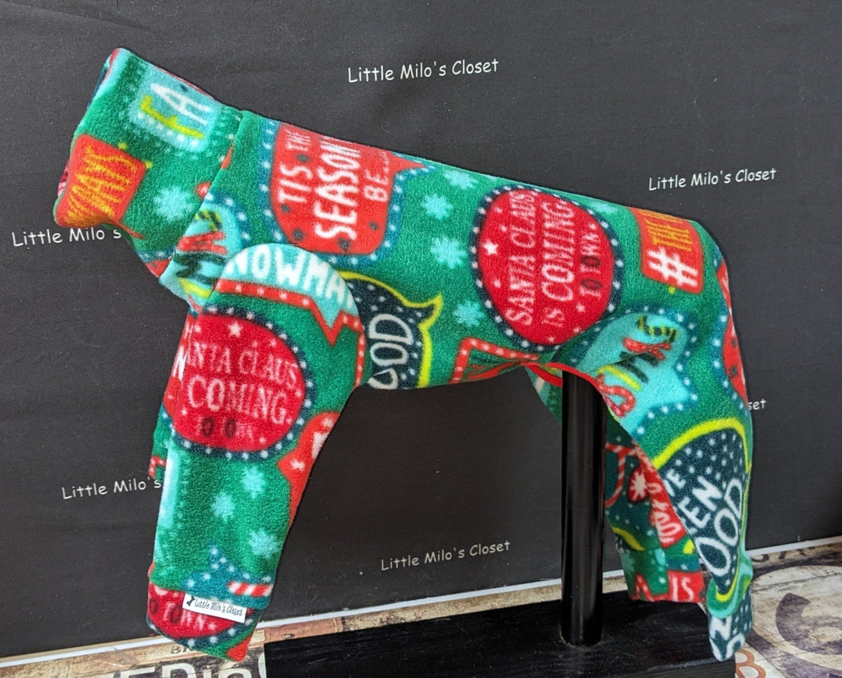 Green holiday words plush fleece jammies for Italian Greyhounds with red and teal Tis the Season bubbles, on a stand