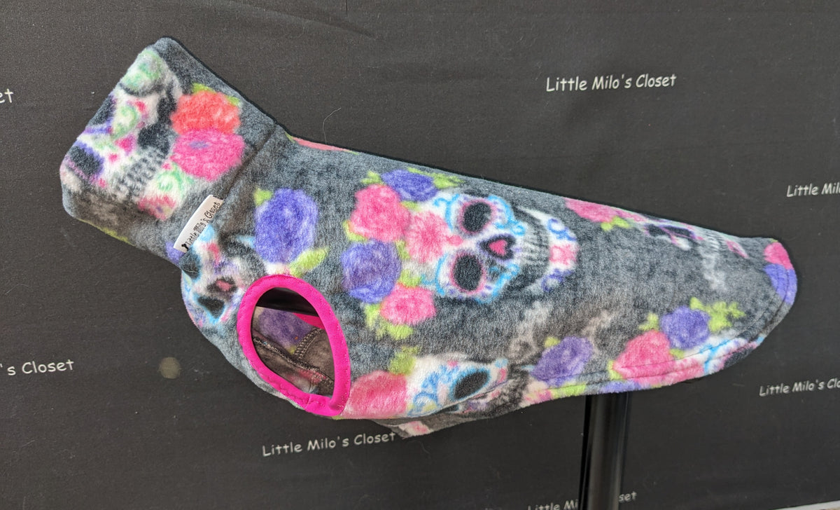 Sugar Skulls Pink Floral fleece vest, grey with skulls and pink and purple roses, on a dog form