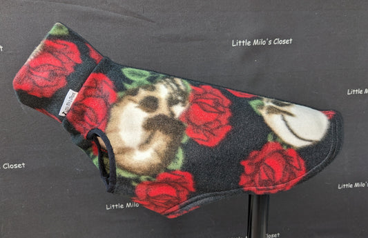 Roses and Skulls fleece vest, black with red roses and cream skulls, on a dog form