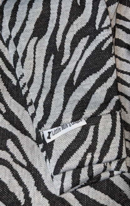 Zebra print hacci knit Italian Greyhound sweater in black and cream, folded flat