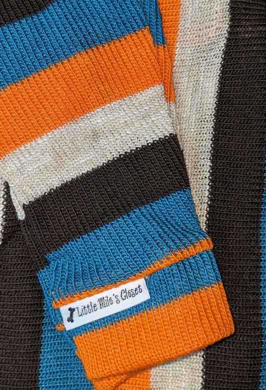Lightweight Italian Greyhound striped sweater in brown, orange, teal and cream, folded to show the ribbed cuff