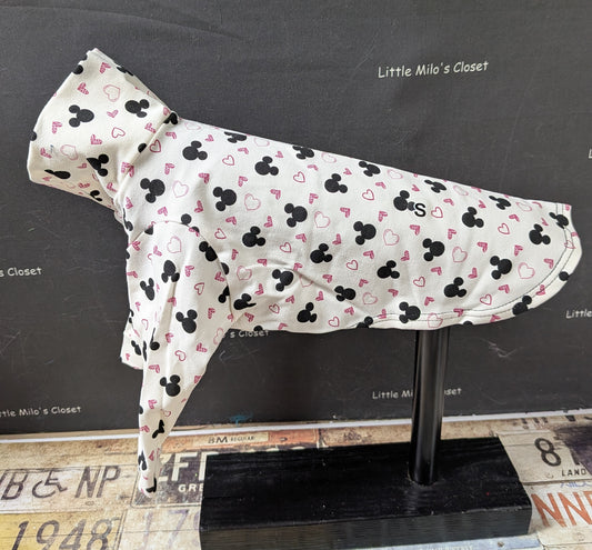 White cotton lycra long sleeve top with black mouse head silhouettes and pink hearts, side view on a dog form