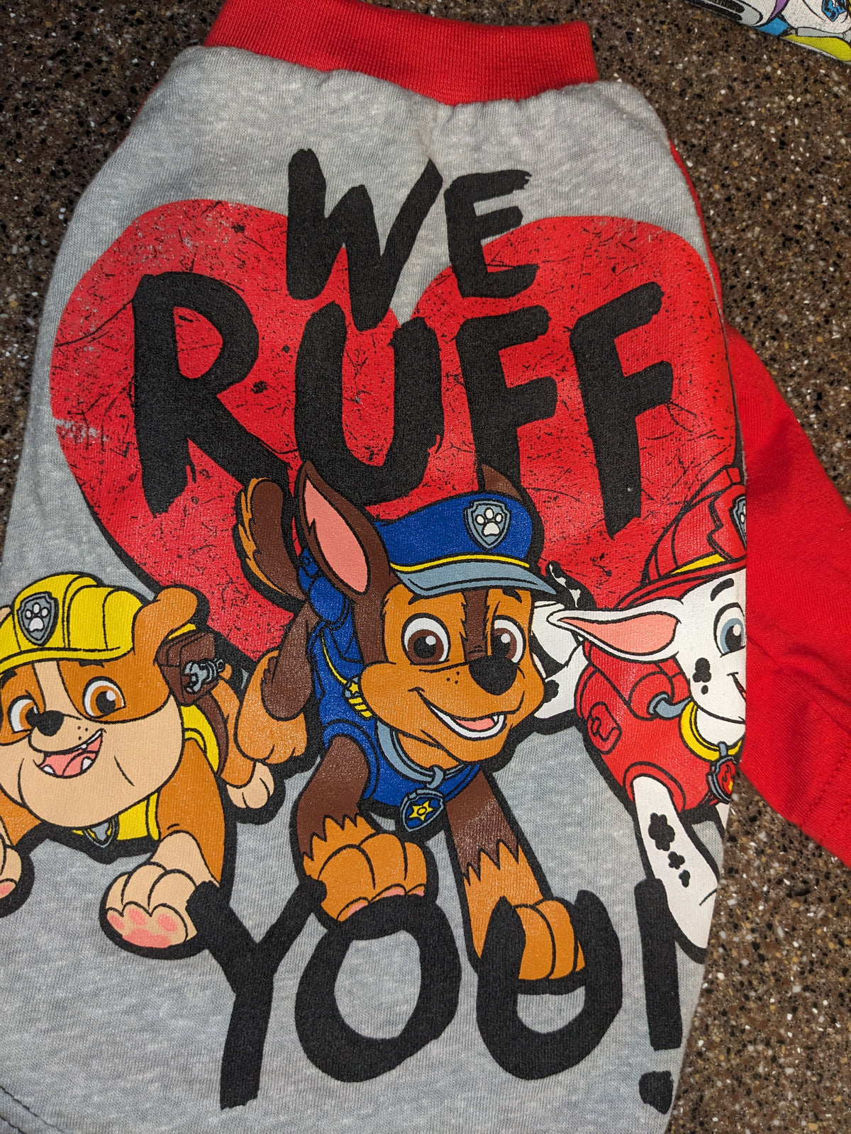 Grey upcycled dog shirt with We Ruff You text over a red heart and cartoon rescue pups, red sleeves, flat lay
