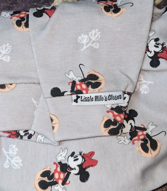 Mouse print cotton knit bodysuit, grey with cartoon mice, folded close-up of the cuff and label