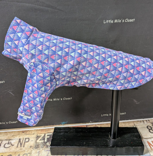 Periwinkle cotton lycra long sleeve top with a pink and white triangle pattern, side view on a dog form
