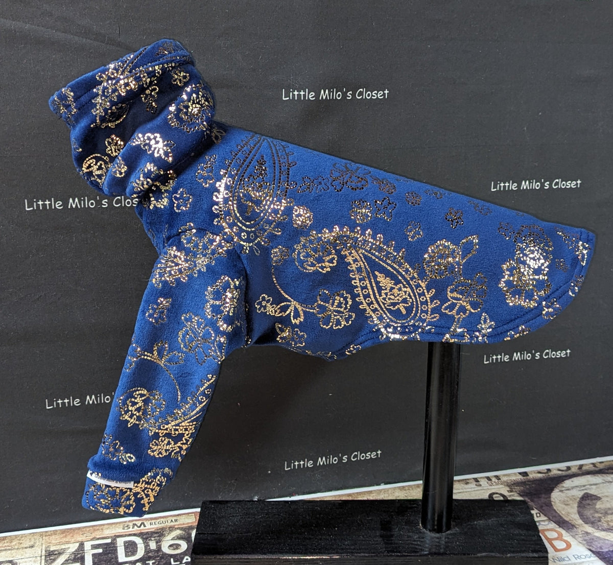 Dark blue microfleece Italian Greyhound top with gold foil paisley on a display stand